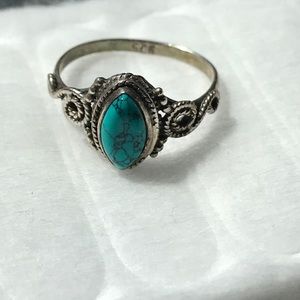 Turquoise ring with swirled detailing on the band